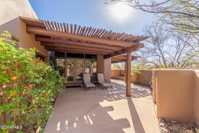 view of patio featuring french doors and a pergola