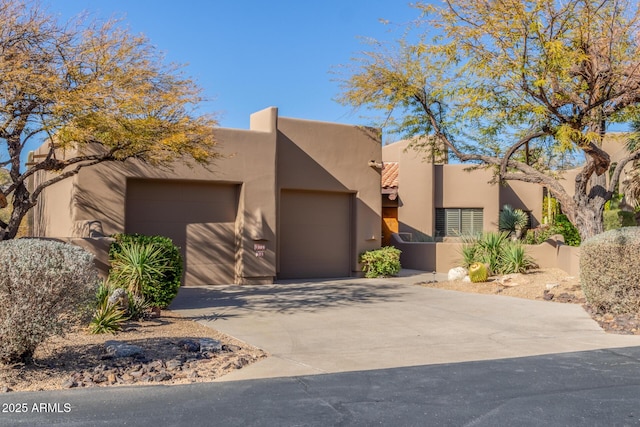 southwest-style home with a garage