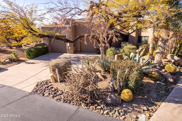 southwest-style home featuring a garage