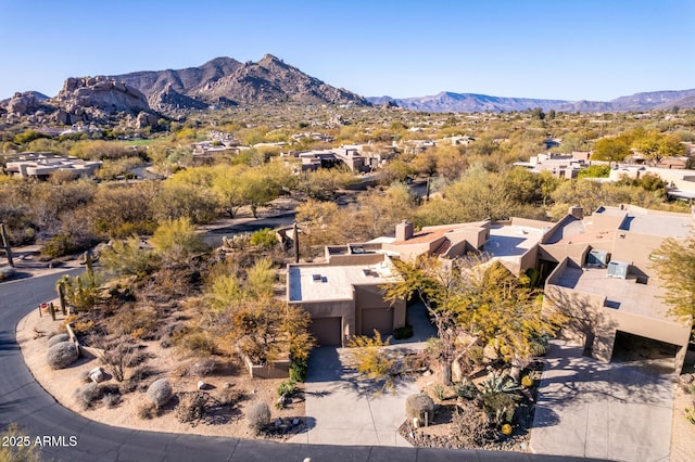 birds eye view of property with a mountain view