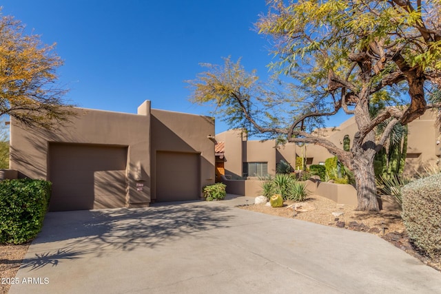 southwest-style home featuring a garage