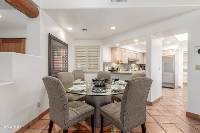 dining room with light tile patterned flooring