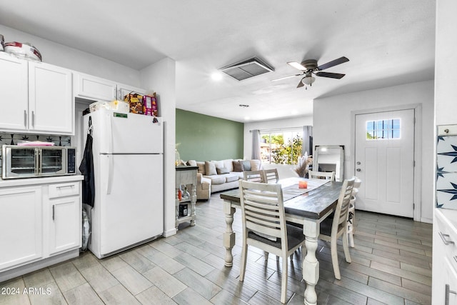 dining space featuring ceiling fan