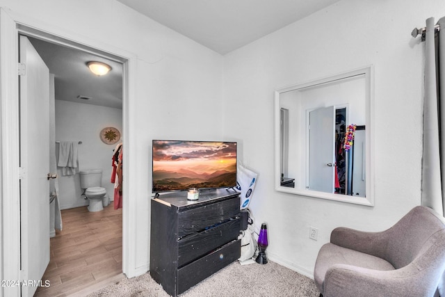 sitting room featuring light hardwood / wood-style flooring