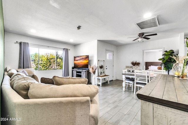 living room with ceiling fan