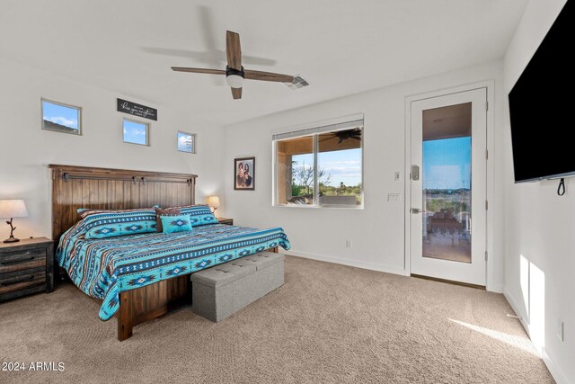 bedroom featuring access to outside, light carpet, and ceiling fan