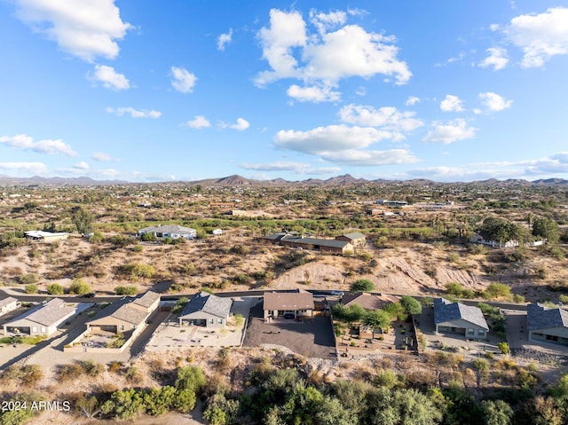 birds eye view of property featuring a mountain view