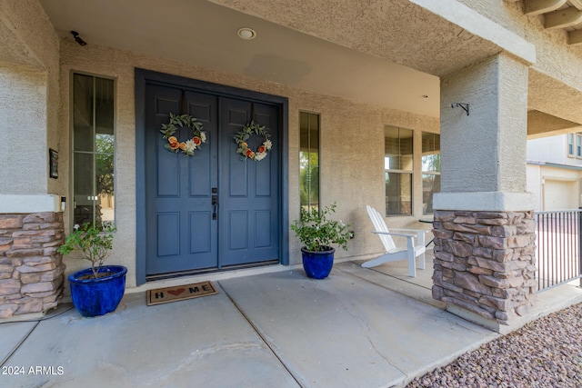 doorway to property featuring a porch