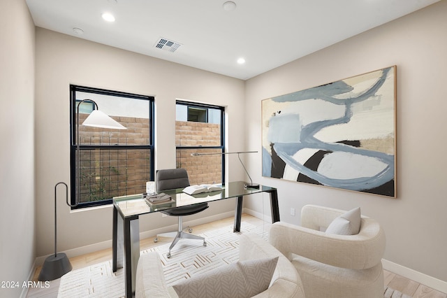 office featuring recessed lighting, wood finished floors, visible vents, and baseboards