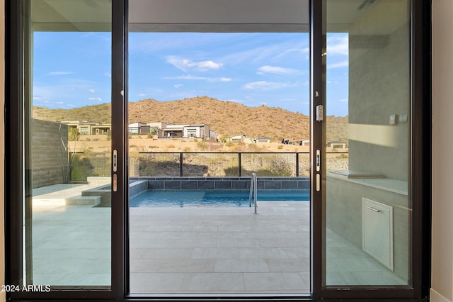 balcony featuring a mountain view