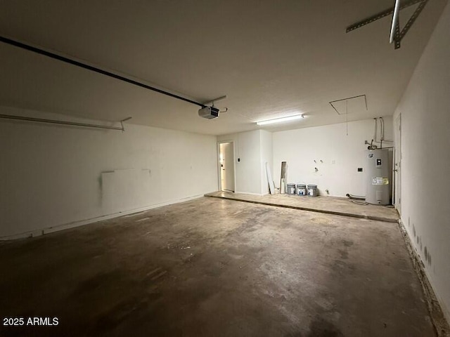 garage featuring electric water heater and a garage door opener