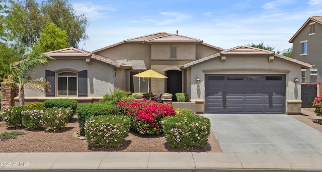 2466 E Aris Dr, Gilbert, AZ 85298 - view of front of house featuring a garage, concrete driveway, stucco siding, and a tiled roof