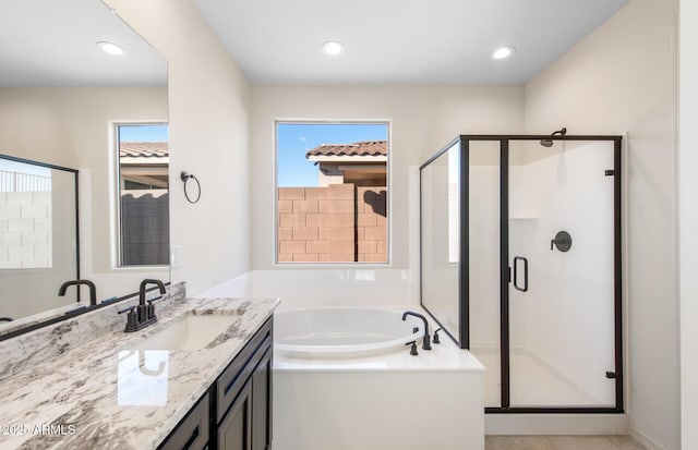 full bath with recessed lighting, a shower stall, vanity, and a bath