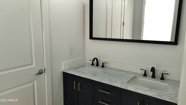 full bath with double vanity and a sink