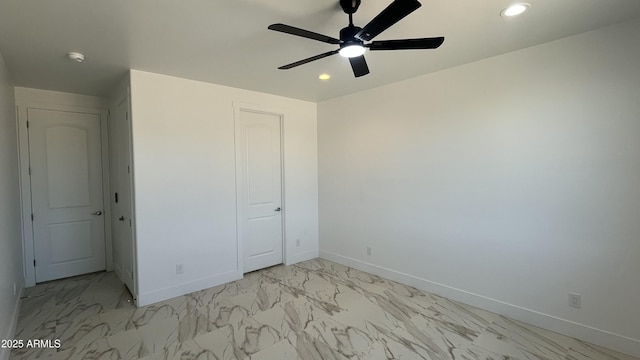 unfurnished bedroom featuring baseboards, recessed lighting, a ceiling fan, and marble finish floor