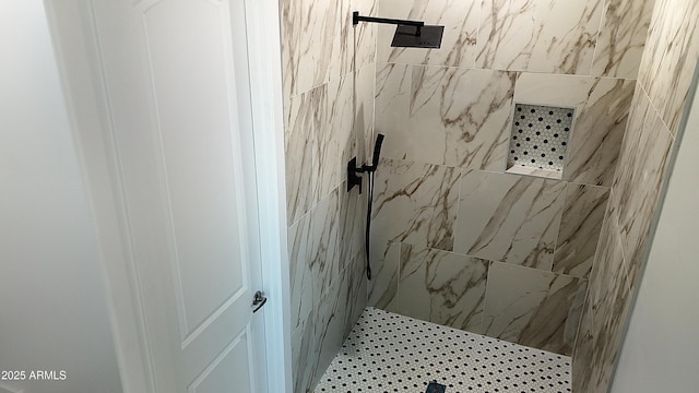 bathroom with tiled shower