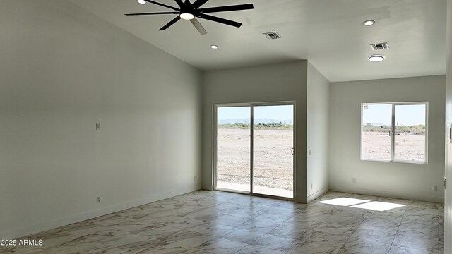 empty room with ceiling fan, visible vents, baseboards, recessed lighting, and marble finish floor