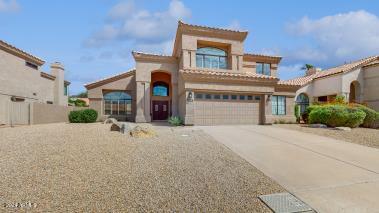 mediterranean / spanish-style home featuring a garage