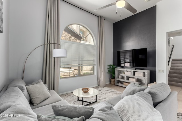 tiled living room featuring ceiling fan