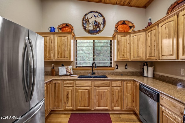 kitchen with wood ceiling, sink, stainless steel appliances, and light wood-type flooring