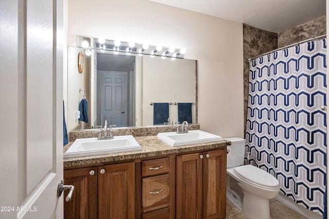 bathroom with tile patterned floors, vanity, toilet, and a shower with curtain