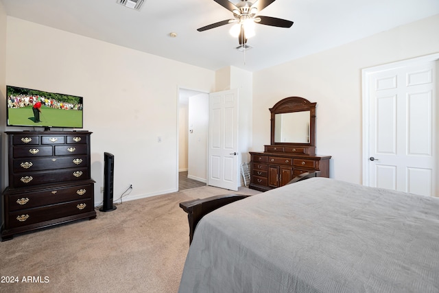 bedroom featuring light colored carpet and ceiling fan