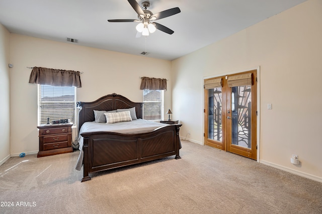 carpeted bedroom featuring ceiling fan, access to outside, and french doors