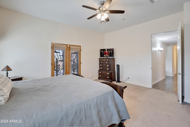 bedroom with access to outside, ceiling fan, french doors, and light colored carpet