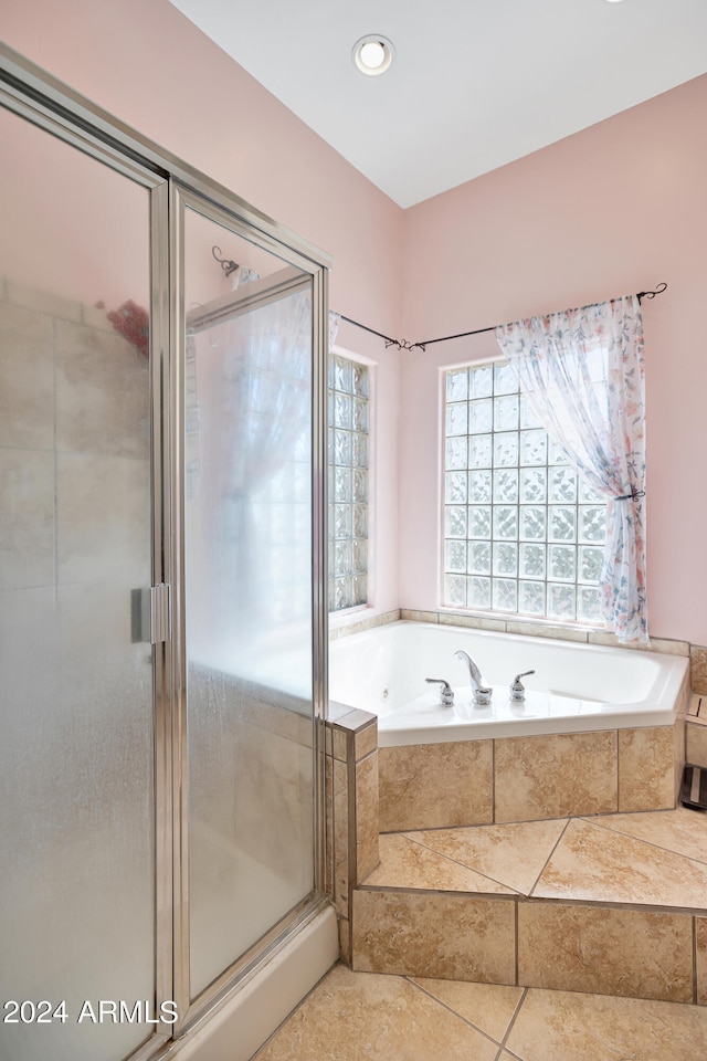 bathroom with tile patterned flooring and plus walk in shower