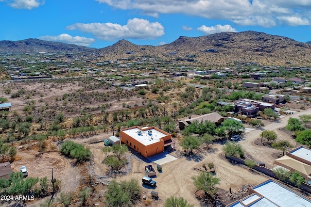 birds eye view of property with a mountain view