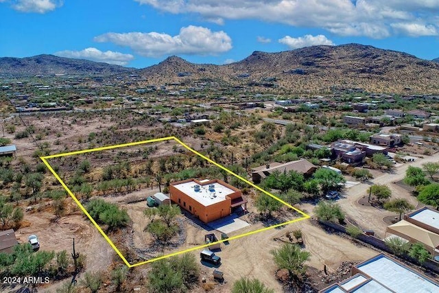 birds eye view of property with a mountain view