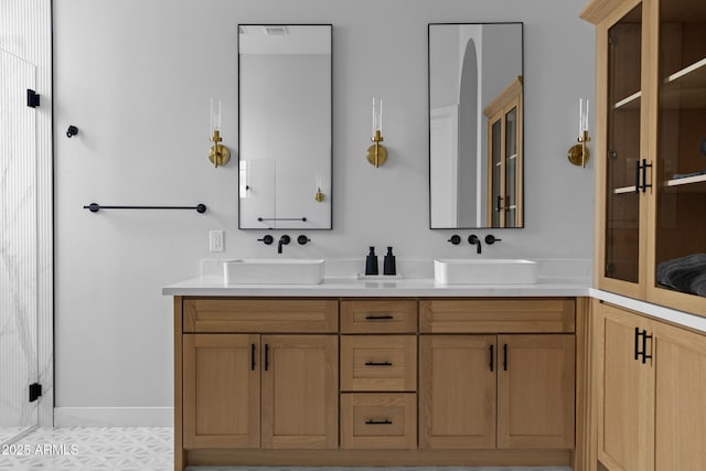 10760 W Golddust Dr, Queen Creek, AZ 85144 - full bathroom with a shower with door, double vanity, and a sink