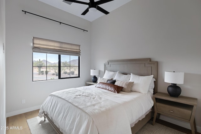 10760 W Golddust Dr, Queen Creek, AZ 85144 - bedroom with baseboards, wood finished floors, and a ceiling fan