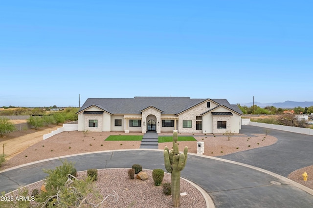 10760 W Golddust Dr, Queen Creek, AZ 85144 - french country home featuring stucco siding, fence, and curved driveway