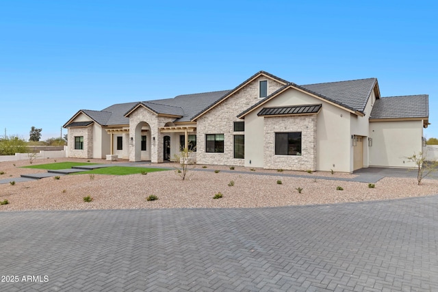 10760 W Golddust Dr, Queen Creek, AZ 85144 - view of front of home featuring stone siding, a tile roof, stucco siding, and an attached garage