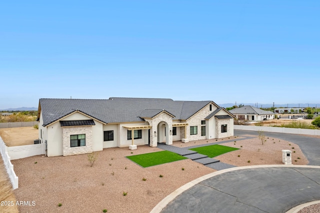 10760 W Golddust Dr, Queen Creek, AZ 85144 - view of front facade with a tiled roof, stucco siding, and fence