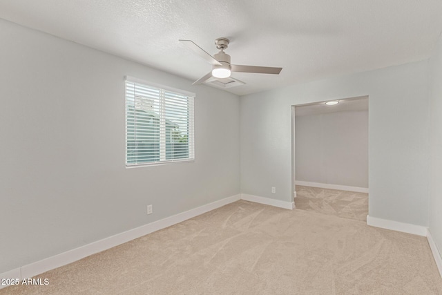 13202 N 40th Pl, Phoenix, AZ 85032 - empty room with light colored carpet, a ceiling fan, baseboards, and a textured ceiling