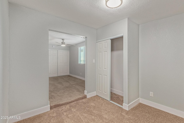 13202 N 40th Pl, Phoenix, AZ 85032 - unfurnished bedroom featuring carpet flooring, a closet, a textured ceiling, and baseboards