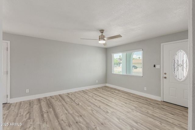 13202 N 40th Pl, Phoenix, AZ 85032 - foyer featuring light wood finished floors, a ceiling fan, baseboards, and a textured ceiling