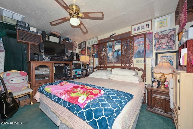 carpeted bedroom with ceiling fan and a textured ceiling