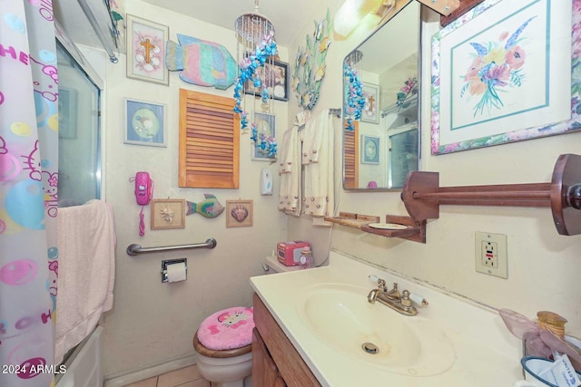 full bathroom featuring vanity, tile patterned floors, toilet, and shower / bath combo