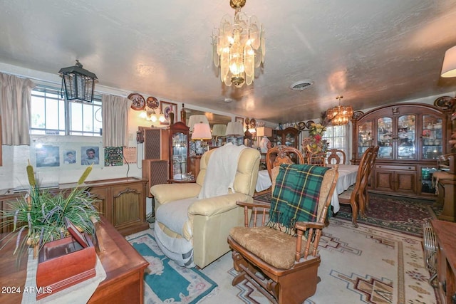 living room featuring an inviting chandelier