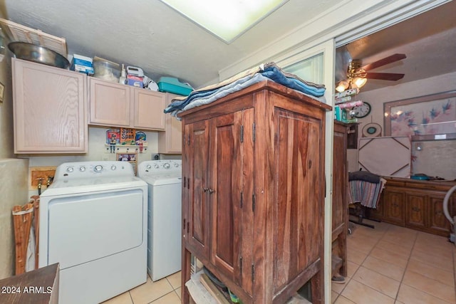 laundry room featuring cabinets, ceiling fan, light tile patterned floors, and washer and clothes dryer