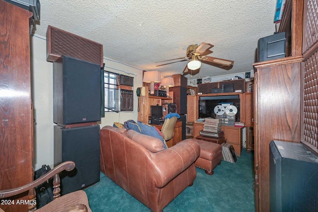 carpeted living room with ceiling fan and a textured ceiling