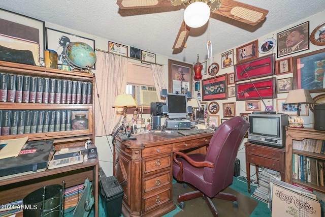 office area with a textured ceiling, ceiling fan, and concrete flooring