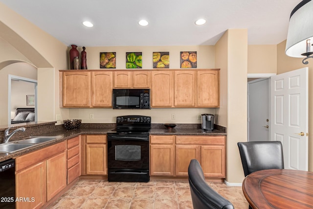 kitchen with sink and black appliances