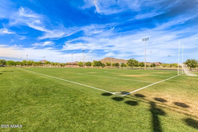 view of property's community with an area for soccer and a mountain view