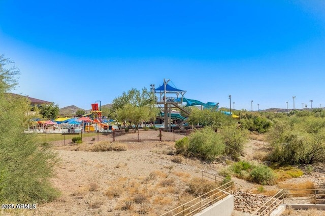 community jungle gym featuring fence