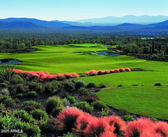 view of home's community featuring a mountain view and view of golf course