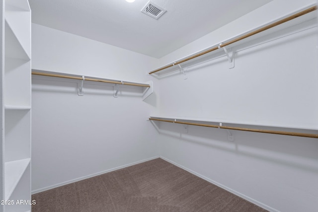 walk in closet with carpet flooring and visible vents